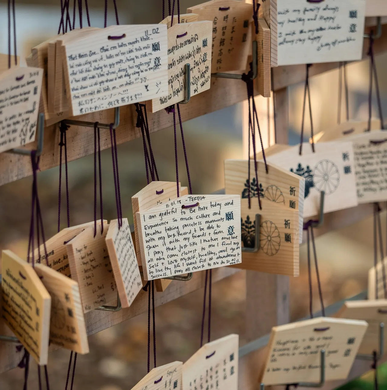 Ema wooden plaques with written wishes. Photo: William Warby - Unsplash